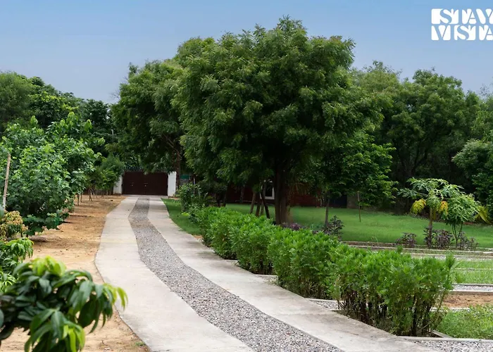 Stayvista's Glasshouse: Orchard Farmstay with Pool and Relaxation