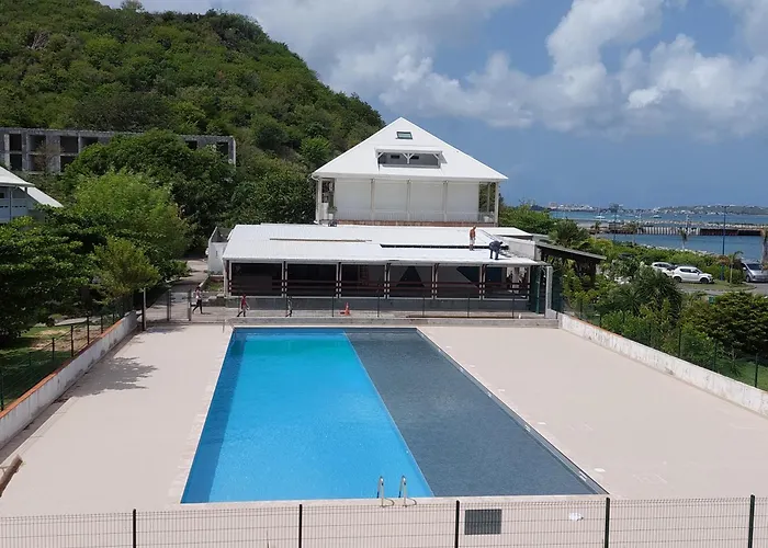 Pélican duplex avec piscine commune dans résidence