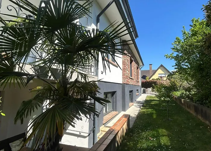 Appartement cosy dans une maison calme et parking gratuit avec borne